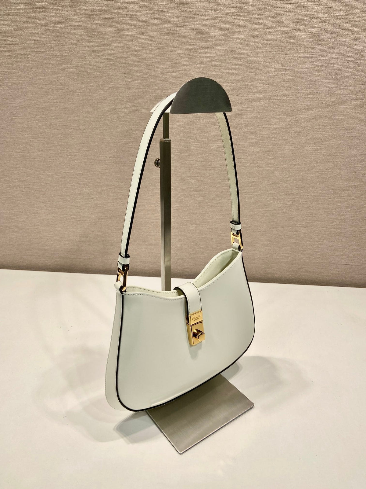 PRADA CLEO SHOULDER BAG 22 IN WHITE BRUSHED LAMBSKIN WITH CLASP CLOSURE
