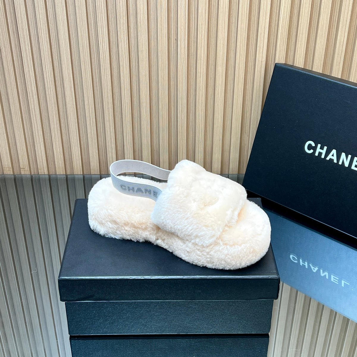 CHANEL 25S THICK-SOLED FURRY SLIPPERS WITH ELASTIC STRAPS IN BEIGE FUR