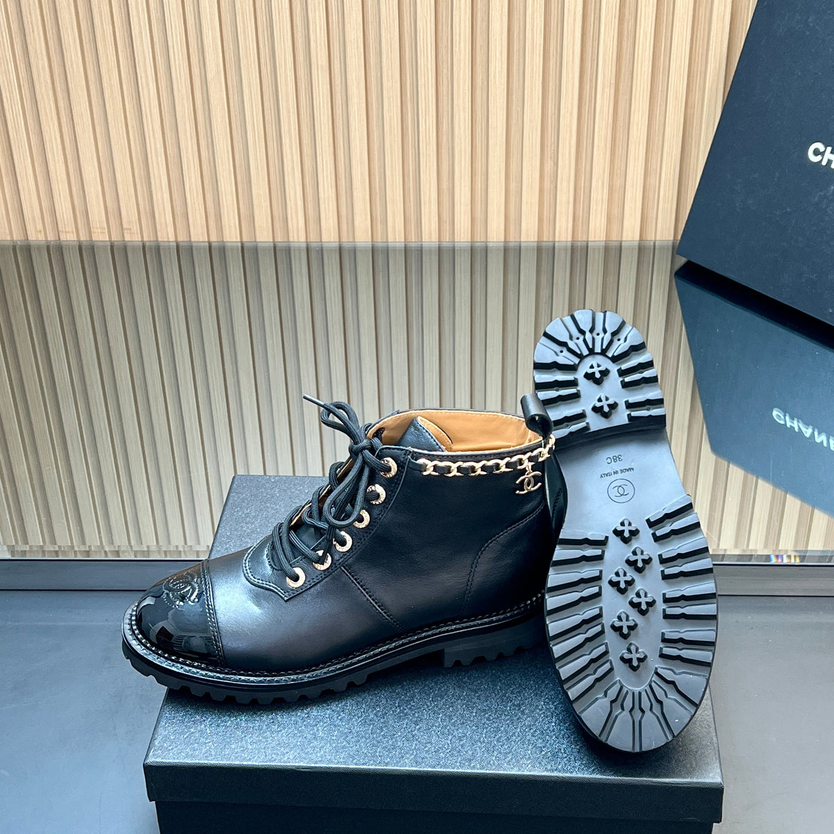 CHANEL 25S MARTIN LACE-UP BOOTS WITH CHAIN DETAIL IN BLACK CALFSKIN