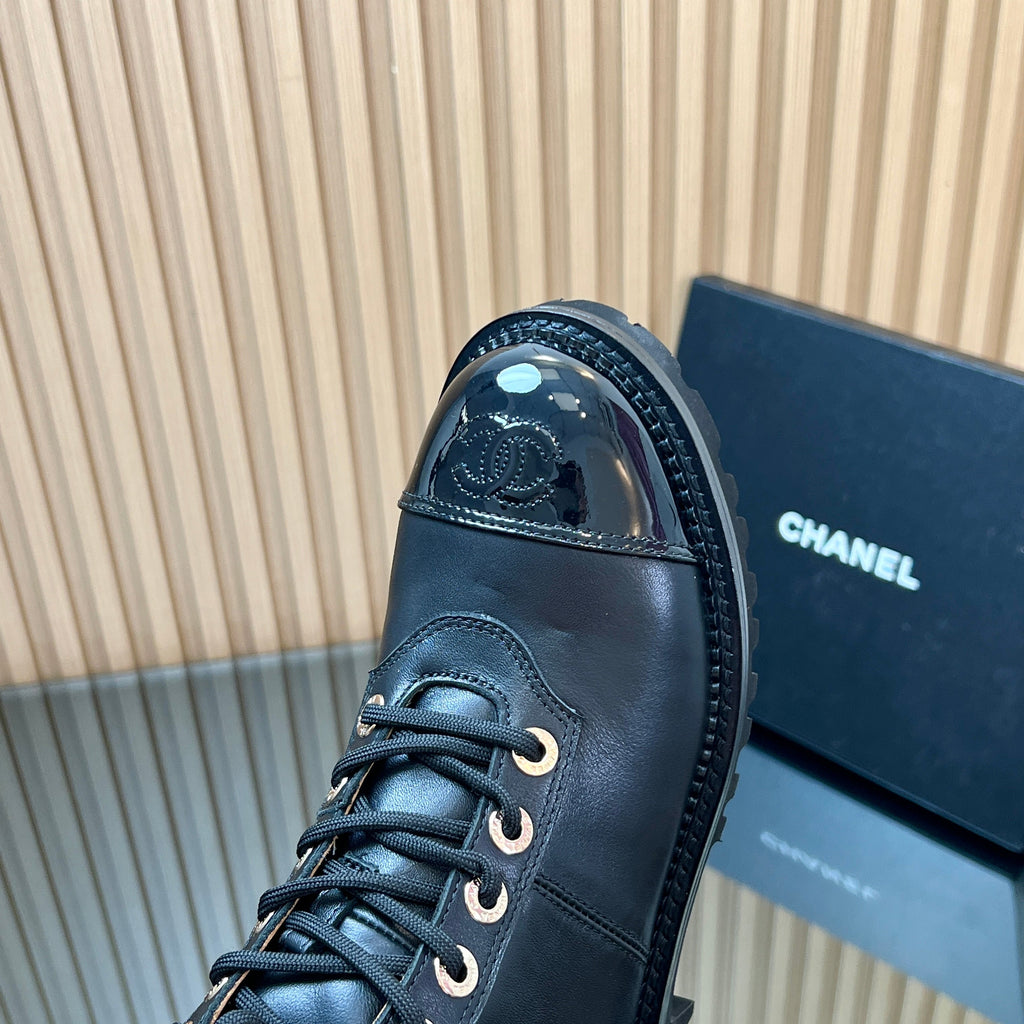 CHANEL 25S MARTIN LACE-UP BOOTS WITH CHAIN DETAIL IN BLACK CALFSKIN