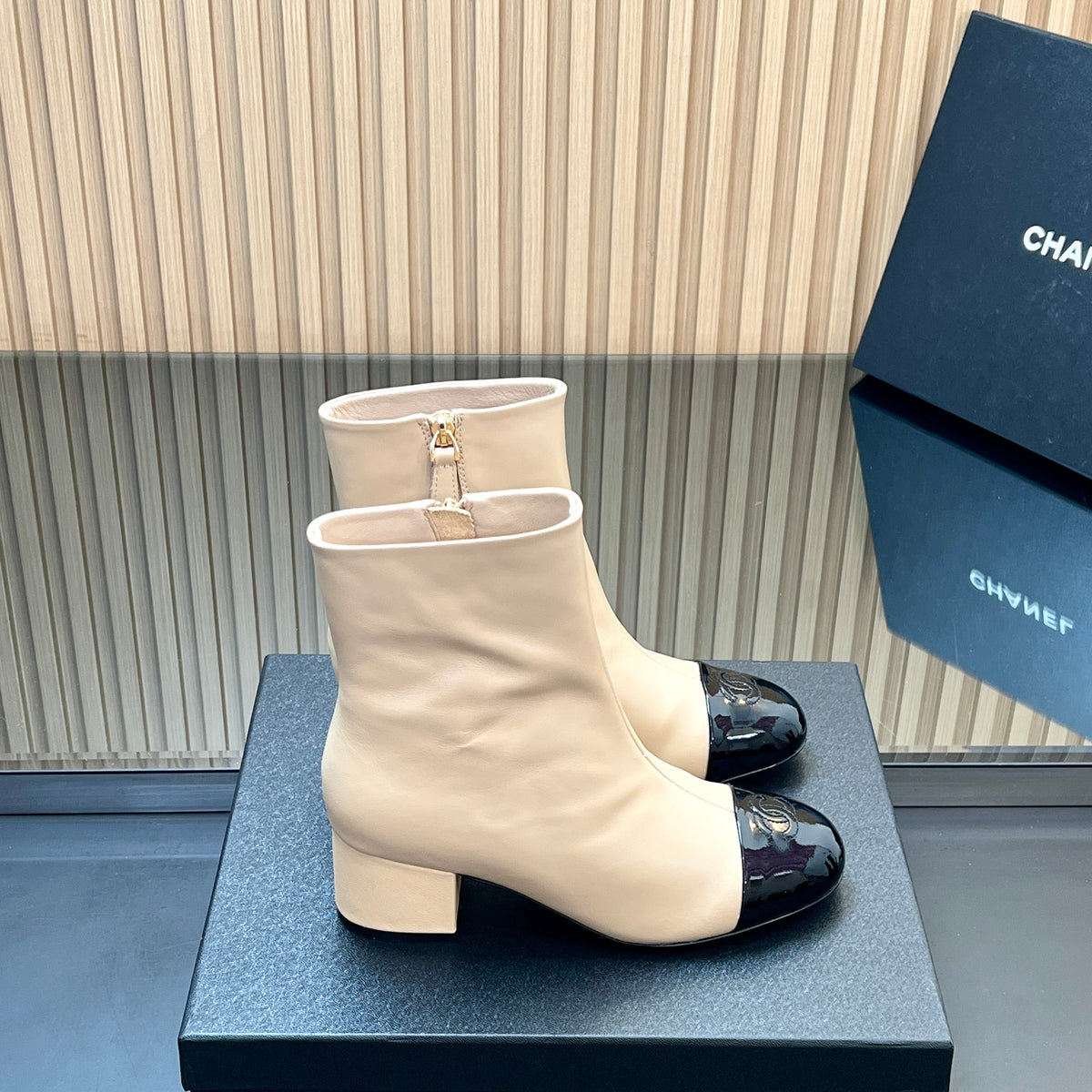 CHANEL 25S BOOTS WITH PATENT TOE CAP 50MM IN BEIGE AND BLACK CALFSKIN