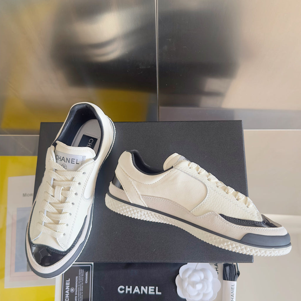 CHANEL 25S SNEAKERS WITH PATENT TOE 20MM IN WHITE CALFSKIN