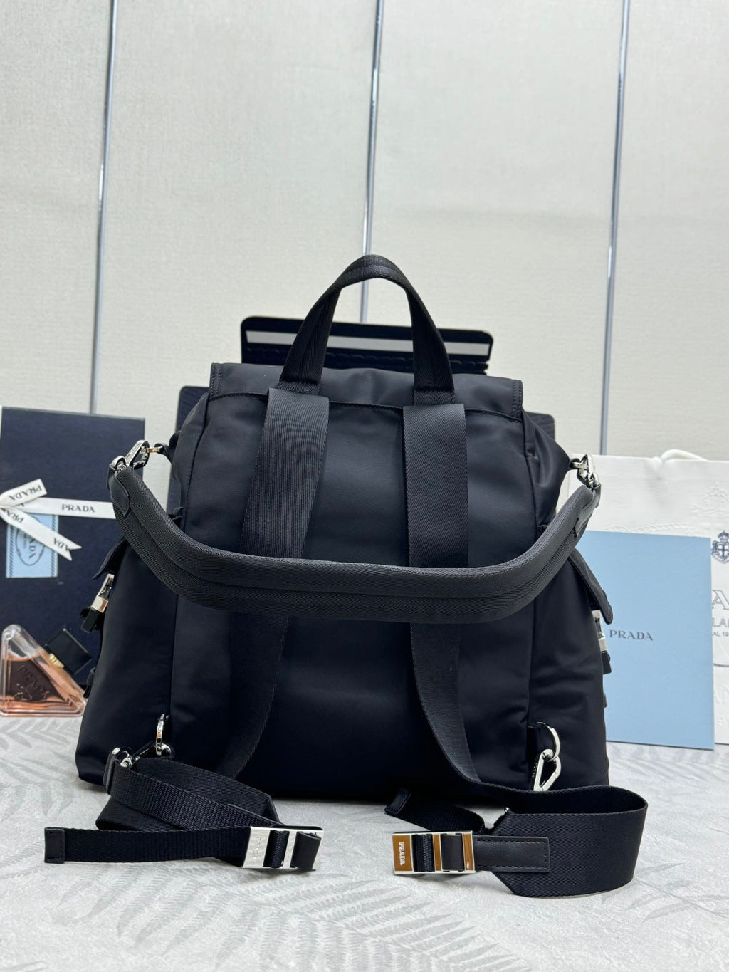 PRADA 25S EXPLORE BACKPACK 39 IN BLACK RE-NYLON AND CALFSKIN