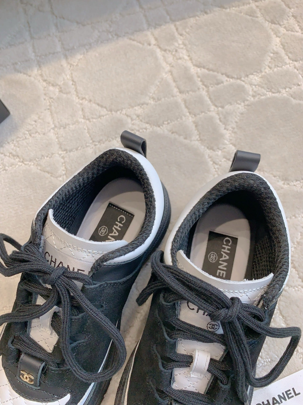 CHANEL 25S TRAINERS 40MM IN BLACK AND WHITE CALFSKIN AND SUEDE