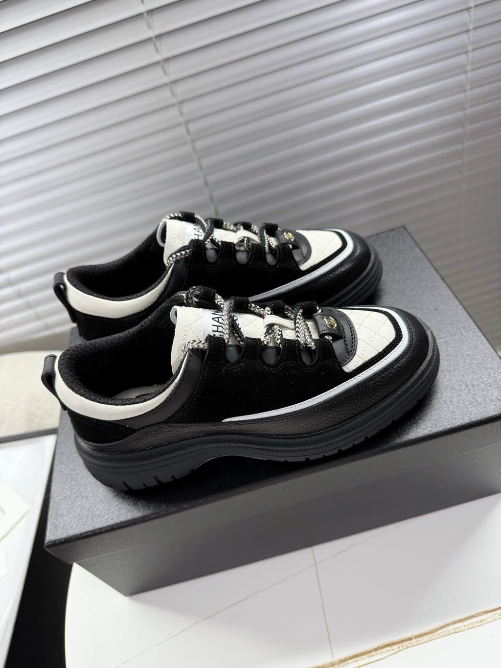 CHANEL 25S SNEAKERS 35MM IN BLACK AND WHITE CALFSKIN