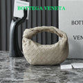 BOTTEGA VENETA 25S MINI JODIE 28 IN MUTED TAUPE SUEDE GOLD HARDWARE